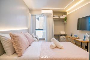 Postel nebo postele na pokoji v ubytování Flats no Mares de Cabo Branco by QAVI