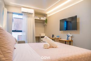 TV a/nebo společenská místnost v ubytování Flats no Mares de Cabo Branco by QAVI