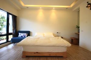 Letto o letti in una camera di Chien Ching B&B