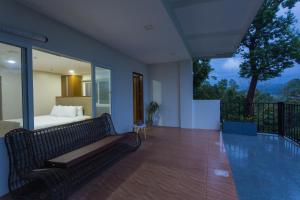 a bedroom with a bed and a swimming pool at Vine and Canopy in Olongapo