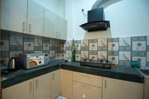 Η κουζίνα ή μικρή κουζίνα στο Abode Homestay +9 φωτογραφίες