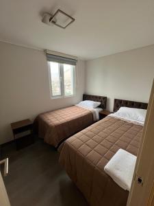 Ένα ή περισσότερα κρεβάτια σε δωμάτιο στο Departamento completo +13 φωτογραφίες