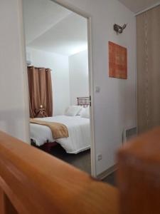 Postel nebo postele na pokoji v ubytování La Maisonnette du Soleil + 4 fotografie