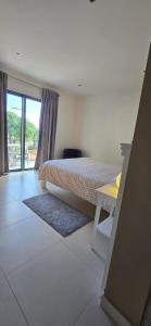 Ένα ή περισσότερα κρεβάτια σε δωμάτιο στο Casa da Praia