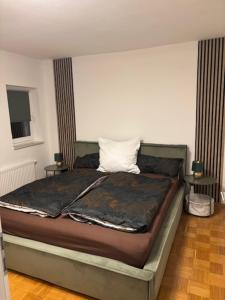 Ένα ή περισσότερα κρεβάτια σε δωμάτιο στο Ferien - Monteurwohnung Roding