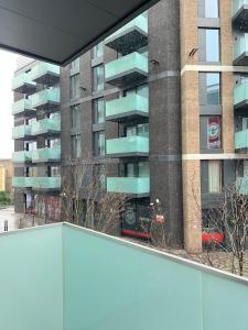 a view of a building from a balcony at 2 Bedroom Brentford in Kew Bridge