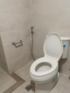 a bathroom with a toilet and a shower at Elegant Studio in Mivela Garden Residences in Banilad