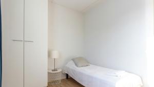 Ένα ή περισσότερα κρεβάτια σε δωμάτιο στο Central Apartment for 3