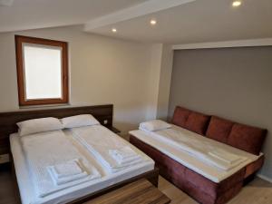 Ένα ή περισσότερα κρεβάτια σε δωμάτιο στο Villa Merdan