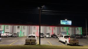 a gas station with cars parked in a parking lot at Americas Best Value Inn Marshall in Bel Air