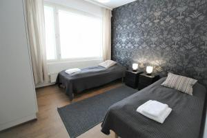 Ένα ή περισσότερα κρεβάτια σε δωμάτιο στο Convenient Apartment for 5 with Sauna