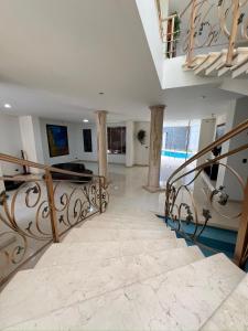 a spiral staircase in a house with a stair case at Casa Vacacional Jpol in Cali