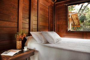 Postel nebo postele na pokoji v ubytování Casa Raul Macacos Suíte