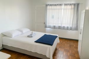 Un pat sau paturi într-o cameră la Hotel Thuris
