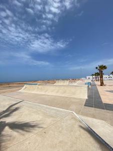 a skateboard park on the side of the beach at Dania Surf House in Mirleft