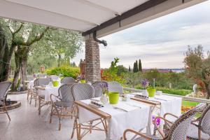 Сад в Olivi Hotel & Natural Spa