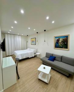 Ένα ή περισσότερα κρεβάτια σε δωμάτιο στο Happy Boutique Home Ercolano