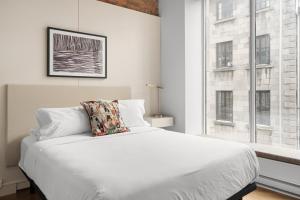 Postel nebo postele na pokoji v ubytování Nomade Saint Paul