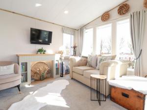 Posezení v ubytování FW4 Fairways 4