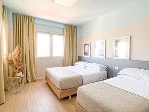 Ένα ή περισσότερα κρεβάτια σε δωμάτιο στο PROMO SEASON Cozy Apartment - SEA VIEW