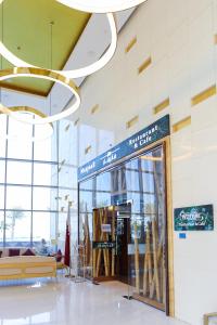 a store with a glass door in a building at Beachfront Home with Sea View - 2BR, 134m2 in Lusail +44 photos