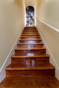 a flight of stairs with a painting on the wall at Alfar Aqueduct - Évora House in Évora