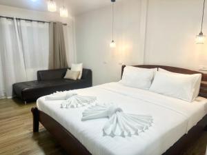 Voodi või voodid majutusasutuse Rungarun Residence toas