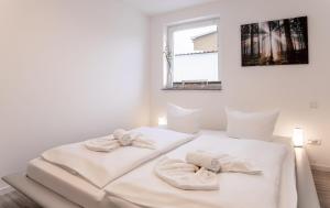 Postel nebo postele na pokoji v ubytování Ostseebad-Zinnowitz-Kernsanierte-Ferienwohnung-Glueck