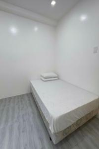 Ένα ή περισσότερα κρεβάτια σε δωμάτιο στο Room in Pinan ZDN