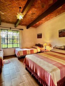 Ένα ή περισσότερα κρεβάτια σε δωμάτιο στο Quinta Los Vela