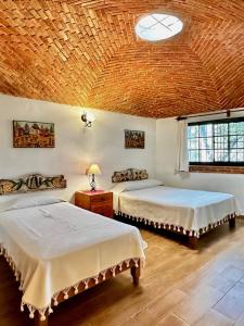 Ένα ή περισσότερα κρεβάτια σε δωμάτιο στο Quinta Los Vela