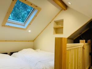 Postel nebo postele na pokoji v ubytování Akagi Log INN Glamping - Vacation STAY 39473v