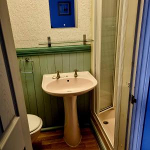 a bathroom with a sink and a toilet at The New Osterley Hotel in Blackpool +7 photos