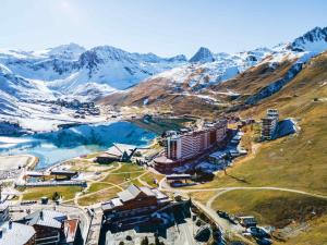 an aerial view of a resort in the mountains at Appartement lumineux skis aux pieds avec balcon - FR-1-502-541 in Tignes +7 photos