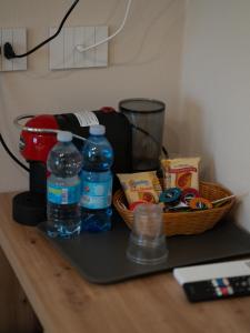 a basket of food and water on a counter at VILLA ISABELLA Ospedale Cisanello in Pisa