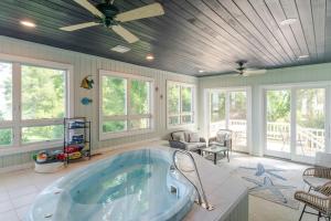 a large bathroom with a large tub in it at Hot Tub and Private Beach Waterfront Urbanna Escape in West Irvington