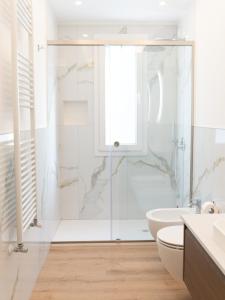 a bathroom with a shower and a toilet and a sink at VILLA ISABELLA Ospedale Cisanello in Pisa +40 photos