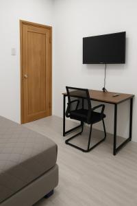 Μια τηλεόραση ή/και κέντρο ψυχαγωγίας στο Room in Pinan ZDN