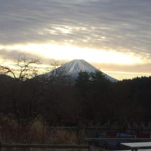 a snow covered mountain in the distance with the sun setting at Little North Campground - Vacation STAY 69020v in Kajikazawa