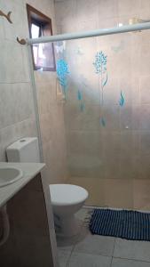 Koupelna v ubytování Suítes no Centro