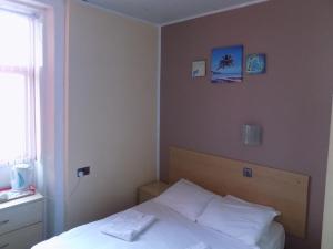 Postel nebo postele na pokoji v ubytování The Royal Windsor Hotel + 101 fotografií