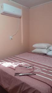 Postel nebo postele na pokoji v ubytování Pousada Ana