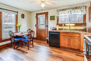a kitchen with a table and chairs and a sink at Pet-Friendly Home with River Access in Crothersville in Scottsburg