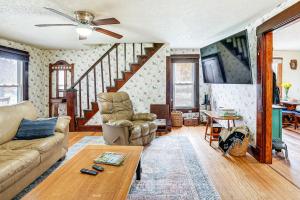 a living room with a couch and a table at Pet-Friendly Home with River Access in Crothersville in Scottsburg