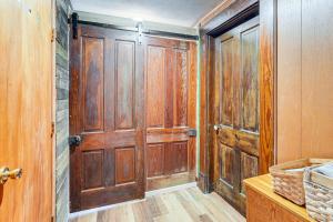 a wooden door in a room with wooden floors at Pet-Friendly Home with River Access in Crothersville in Scottsburg +16 photos