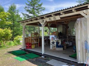 a gazebo with a sign on top of it at Kitakaruizawa Acorn Mountain Ichibanboshi Campsite - Vacation STAY 53268v in Kita-karuizawa