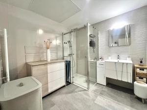 a bathroom with a shower and a toilet and a sink at Modern Luxury - Sea View over Èze Village in Èze +23 photos