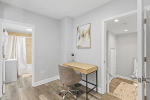 a home office with a desk and a chair at 3 BD 2 BA Home near Ohare Airport sleeps 8 in River Grove
