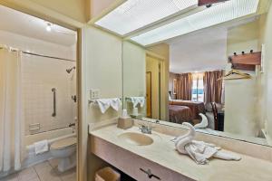 a bathroom with a sink and a large mirror at Hotel O Star Motel Hattiesburg HWY 49 in Hattiesburg