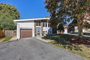 a house with a garage and a driveway at 4 Bedroom full house with 4 car parking in Kingston